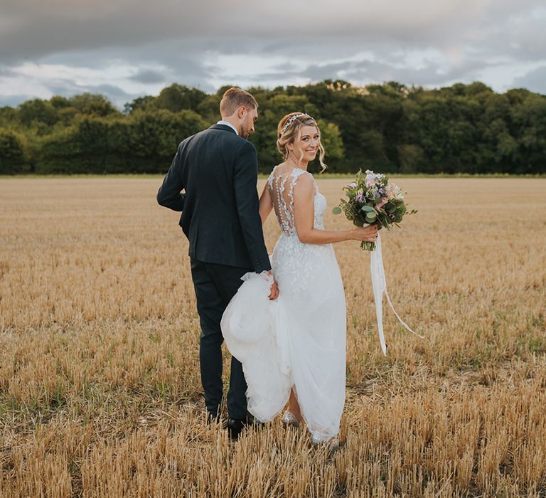 Countryside wedding at Dove Barn in Suffolk with the bride and groom getting their couple portraits out in nature 