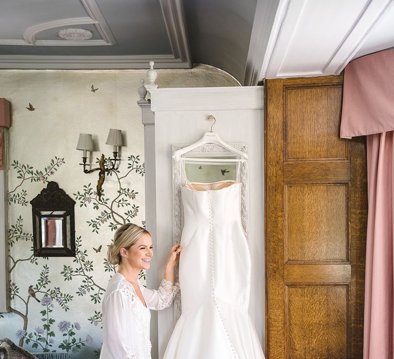 Button back Pronovias mermaid wedding dress for traditional wedding at The Manor House, Castle Combe 