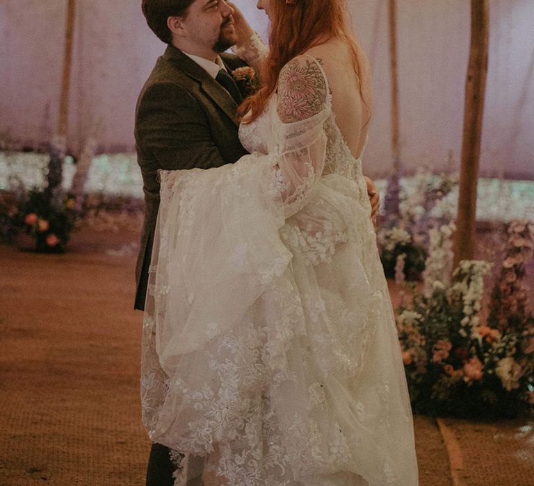 Groom in tweed suit with the bride in boho floral lace off the shoulder wedding dress 