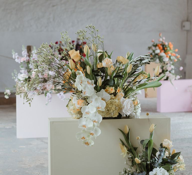 Seasonal spring pastel wedding flowers on the tables at The Cowshed Crail 