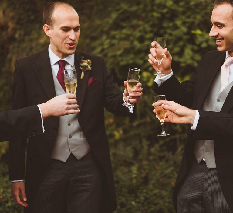 Groomsmen drinking champagne in celebration of the wedding 