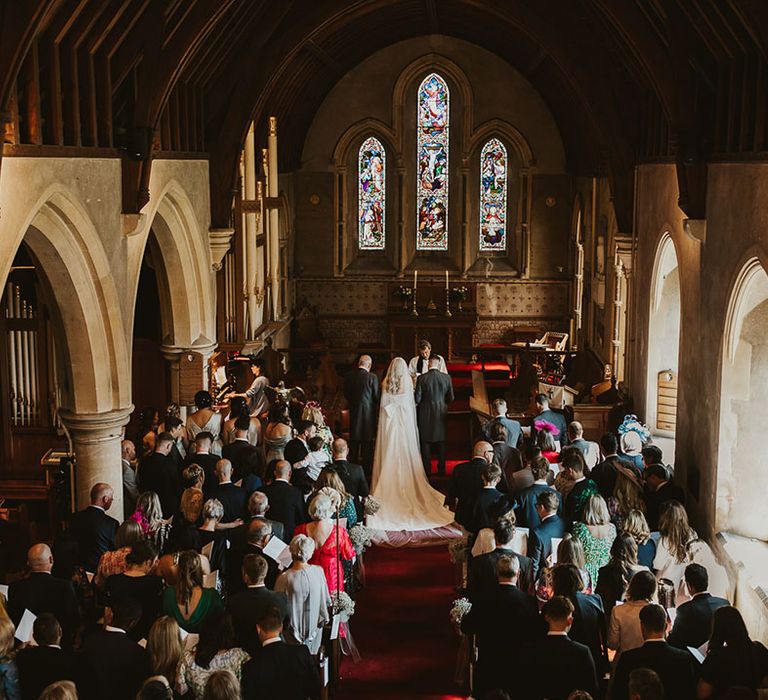 Traditional church wedding with stained glass windows 