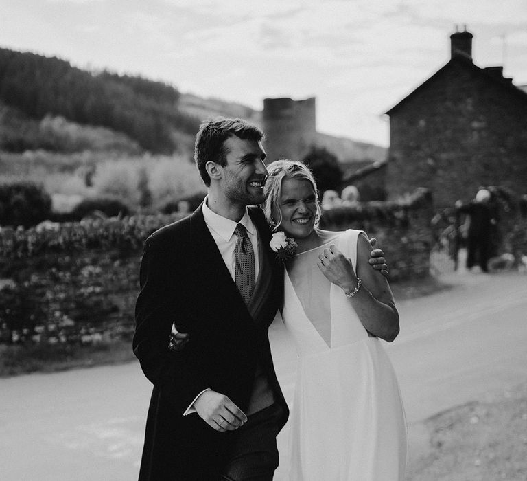 Groom in traditional morning suit for traditional wedding with the bride in classic Andrea Hawke wedding dress 