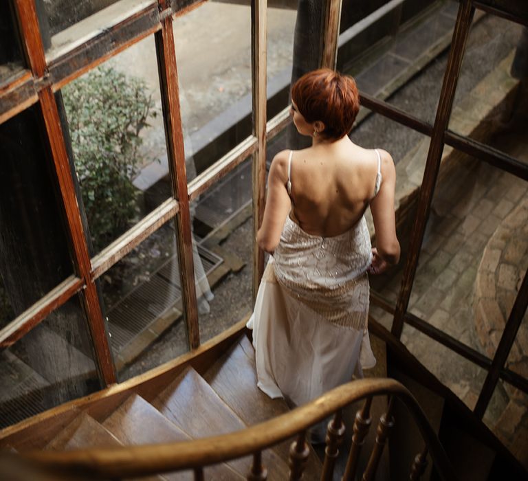 Bride walking downstairs at Brazilian destination wedding wearing sparkly embellished wedding dress 