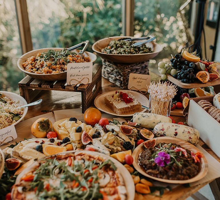 Wedding grazing table with buffet style food and stone basked pizzas 