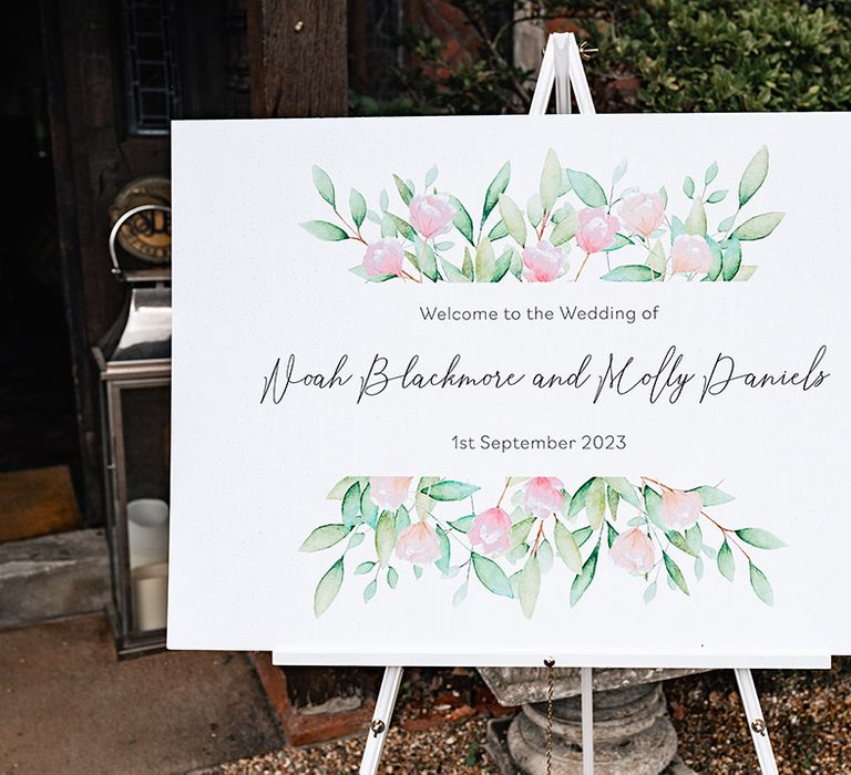 Pink floral wedding welcome signage 