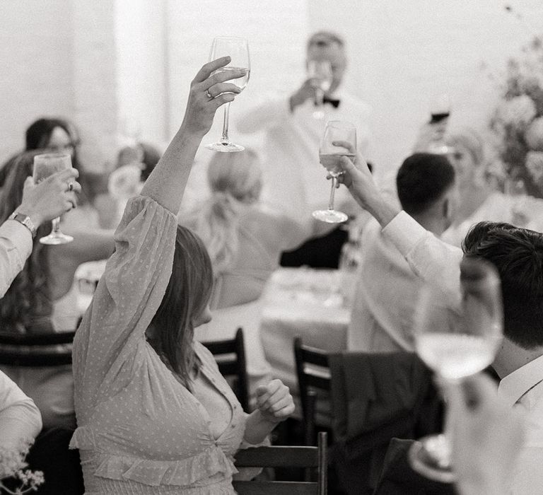 Wedding guests cheers to the wedding toast 