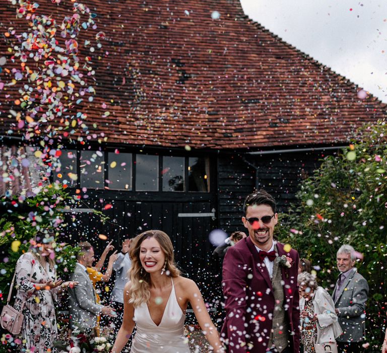 Confetti moment at High Billinghurst Farm by Epic Love Story