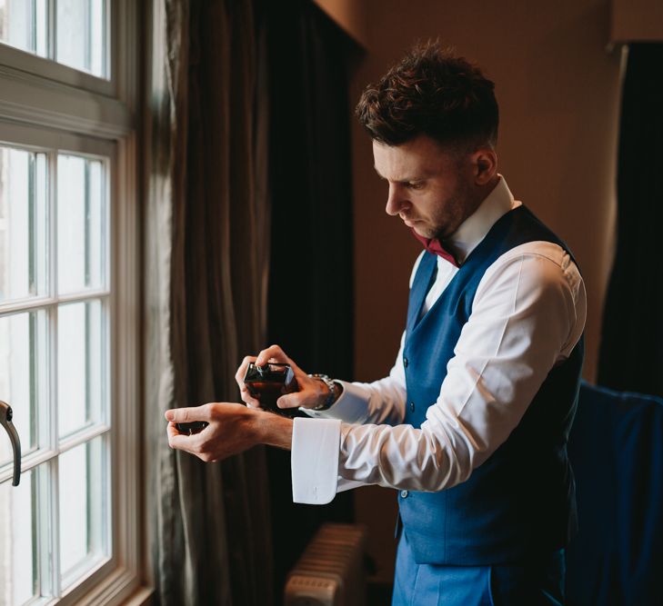 Groom getting ready on the morning of the wedding 