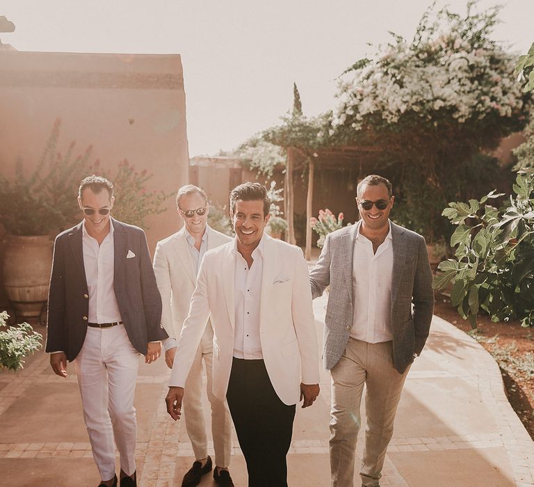 Groomsmen in trousers, open button shirts and jackets for Marrakech wedding 