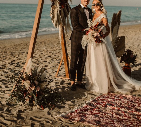 Couple in sunglasses after beach wedding in Crete