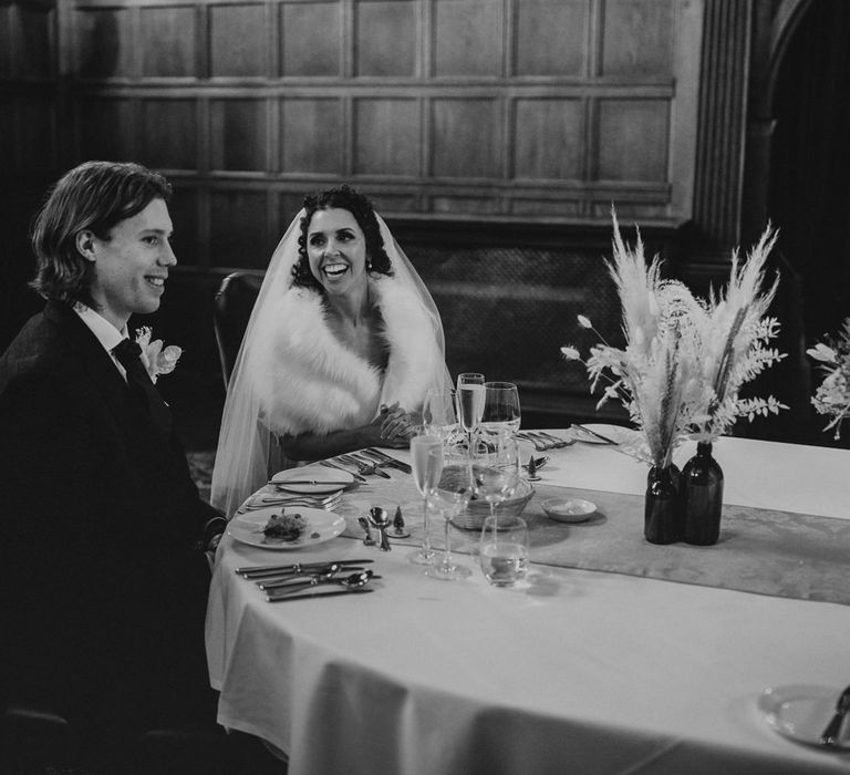 Christmas micro wedding at Rhinefield House wedding venue with bride in a faux fur stole 