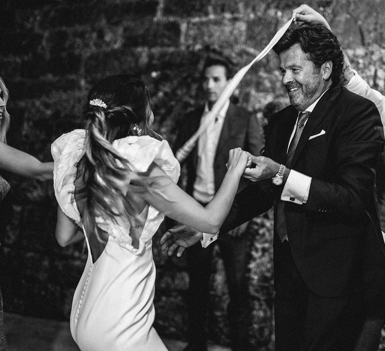 Father of the bride and his daughter dancing at the evening wedding reception 