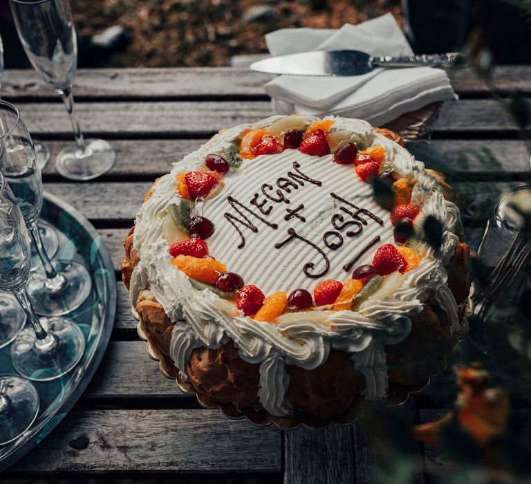 Wedding cake with Megan & Josh written on top in icing