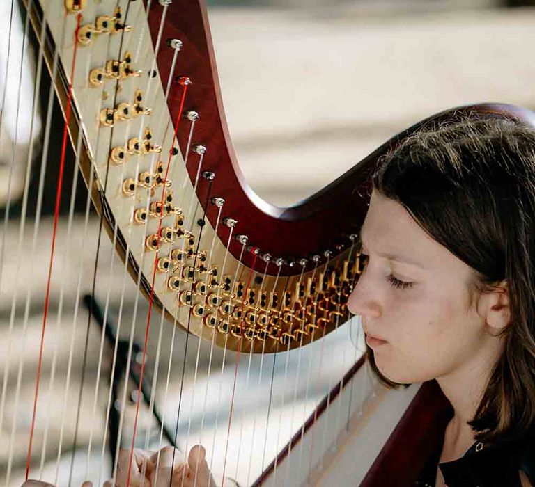 Harpist plays during romantic Italian wedding 