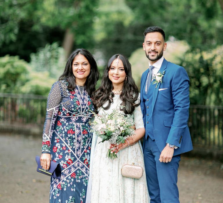 Muslim bride in a mint green sari with her siblings 