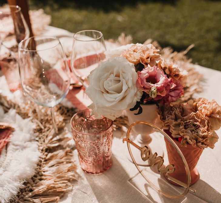 Neutral and coral wedding table decor and flowers