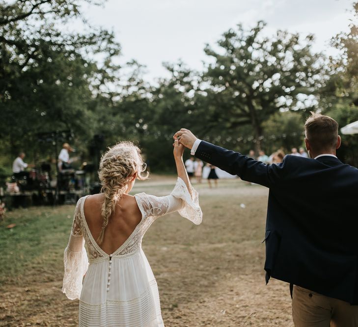 Bride in a bell sleeve boho wedding dress for an outdoor wedding in Tuscany 