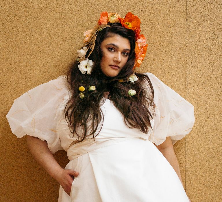 Bride wearing bridal separates with pocket maxi skirt, and sheer puff sleeve top