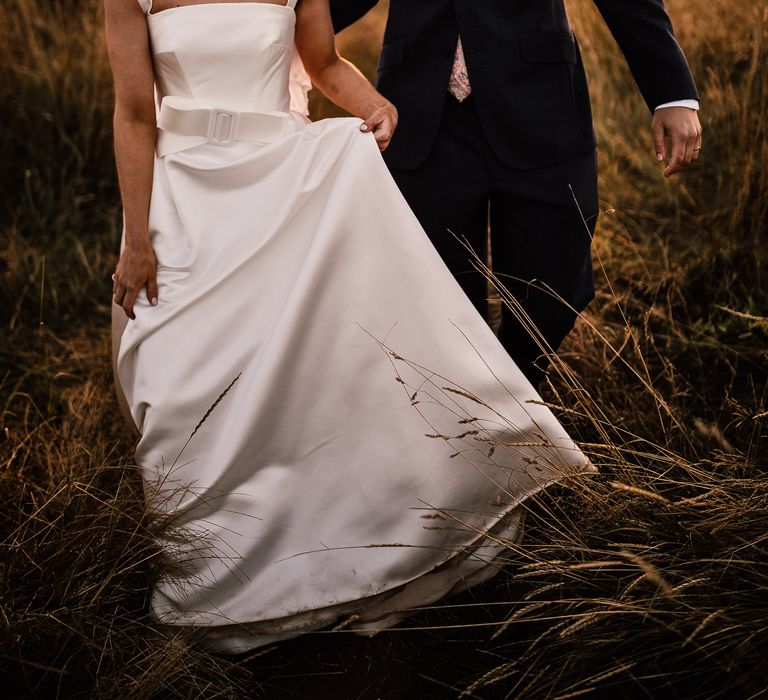 Bride and groom in sunset portrait at garden wedding