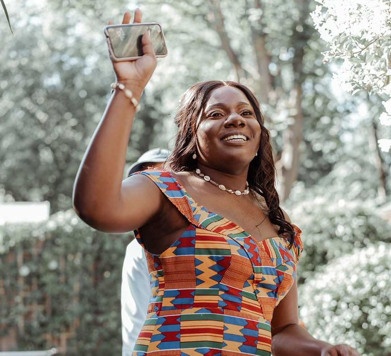 Bride laughs on her wedding day outdoors