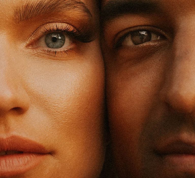 Close up image of bride & grooms face on wedding day