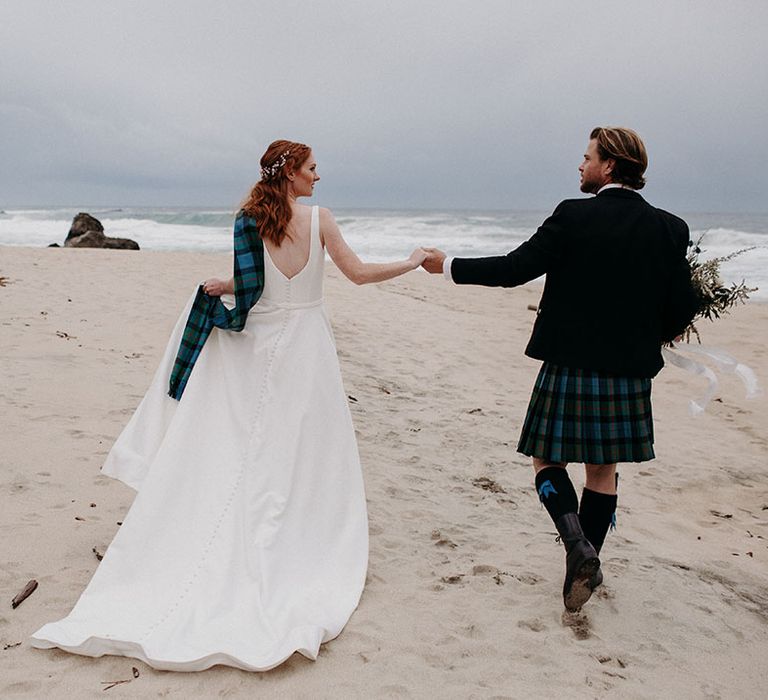 Big Sur coastal wedding photography with bride and groom dresses in blue and green tartan 