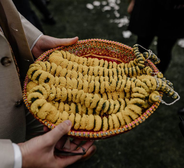 Yellow Milni garlands for multicultural wedding