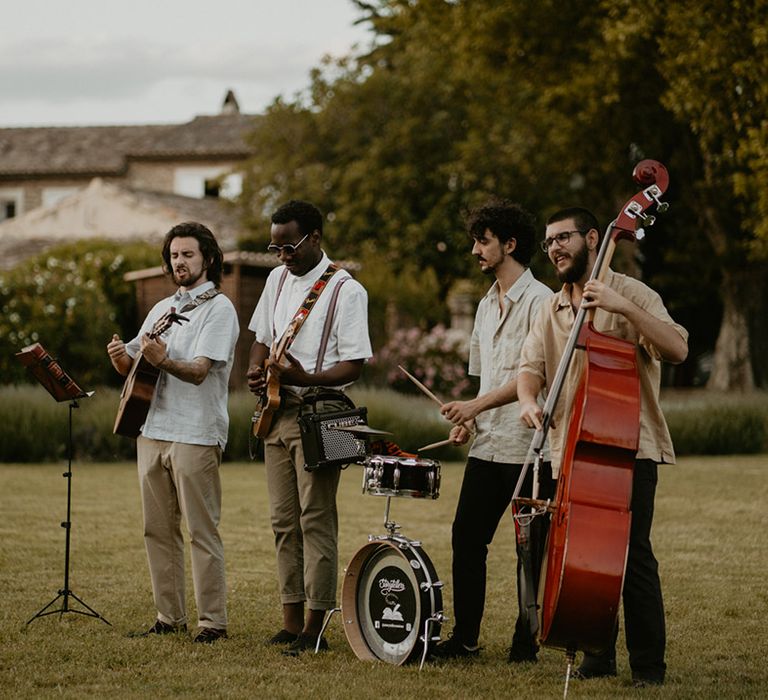 Wedding band plays outdoors in Mas Loisonville for outdoor wedding reception in France