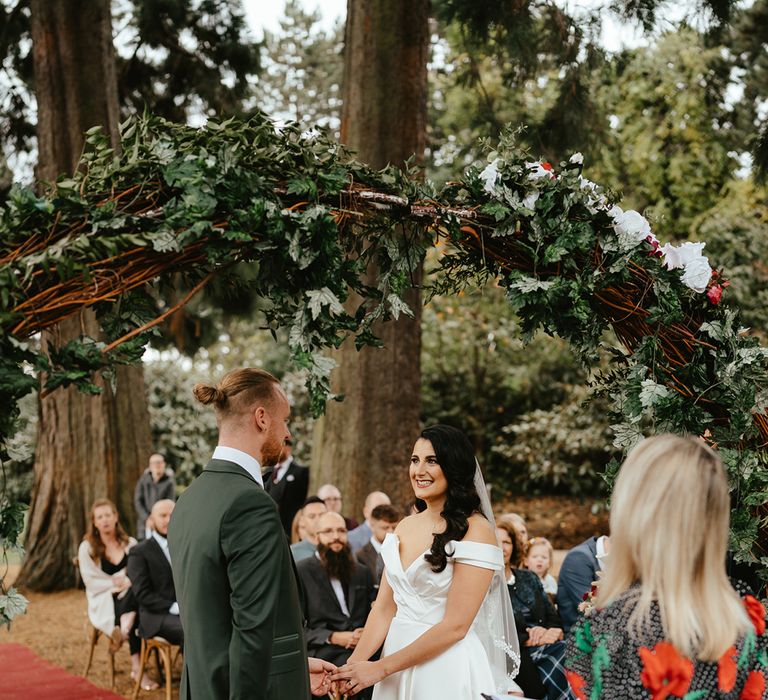 Bride & groom during outdoor handfasting ceremony at the Royal Botanic Garden Edinburgh