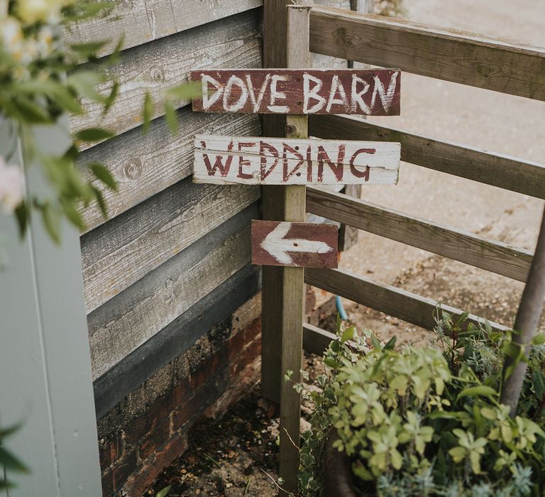 Dove Barn Weddings venue with handpainted signage directing the guests 