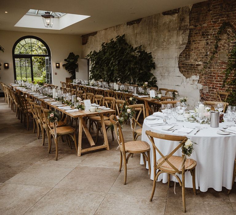 Middleton Lodge Estate wedding venue with round and long banquet wedding tables decorated with white drapery and pink and white roses