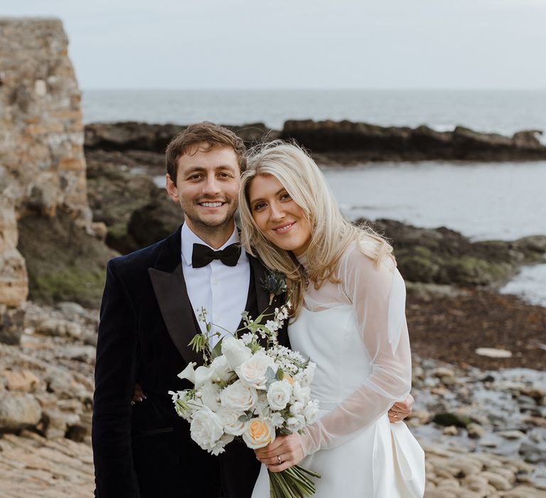 Bride in Jessica Bennett wedding dress with groom in tartan trousers and black tuxedo jacket