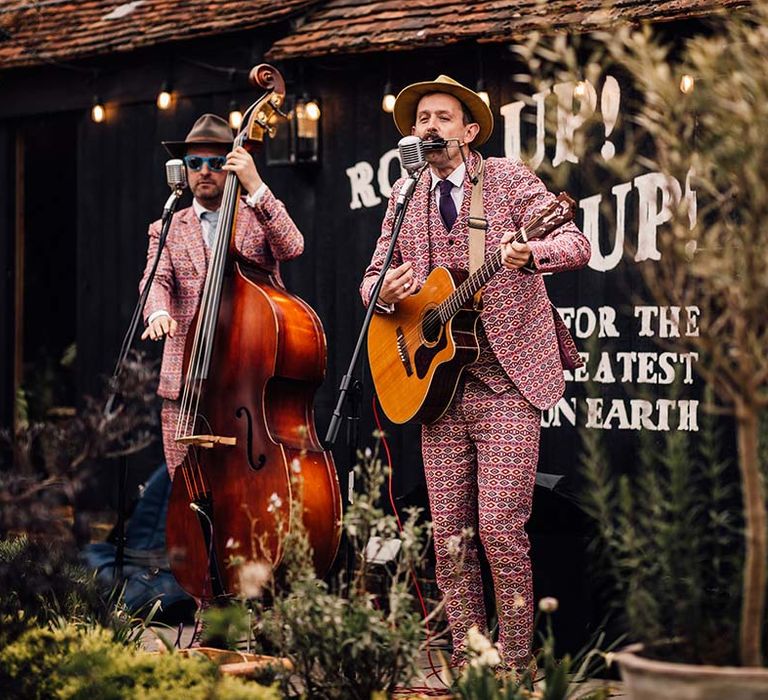 Outdoor wedding band in matching funky suits 