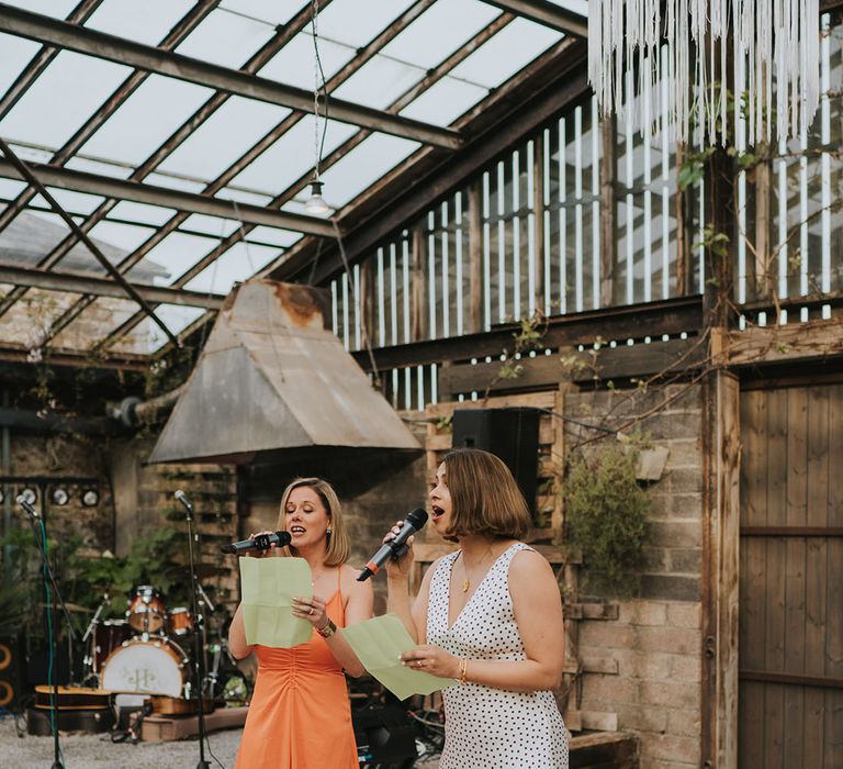 Wedding guests performing a surprise wedding song medley for the brie and groom 