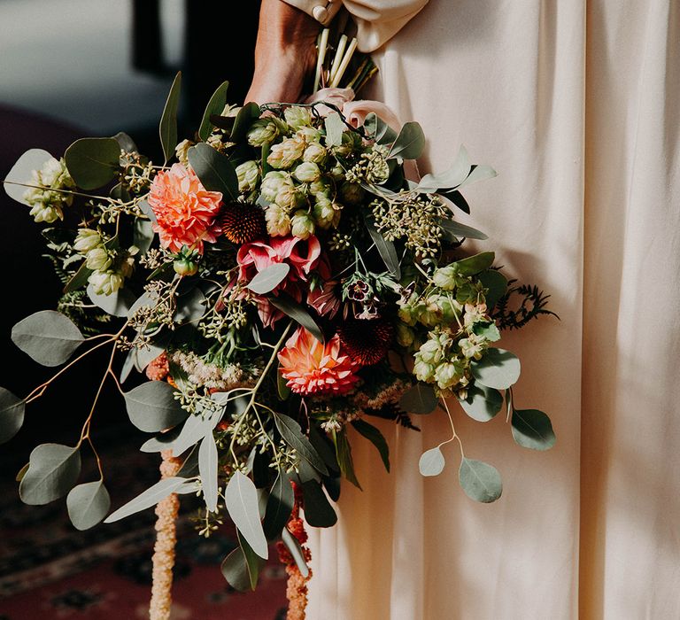 Fluffy green textured wedding bouquet with dahlias and thistle flowers for fall wedding 