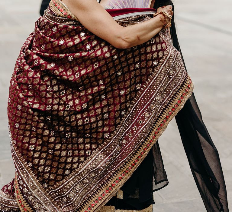 Wedding guests embracing each other at the stunning multicultural wedding day 