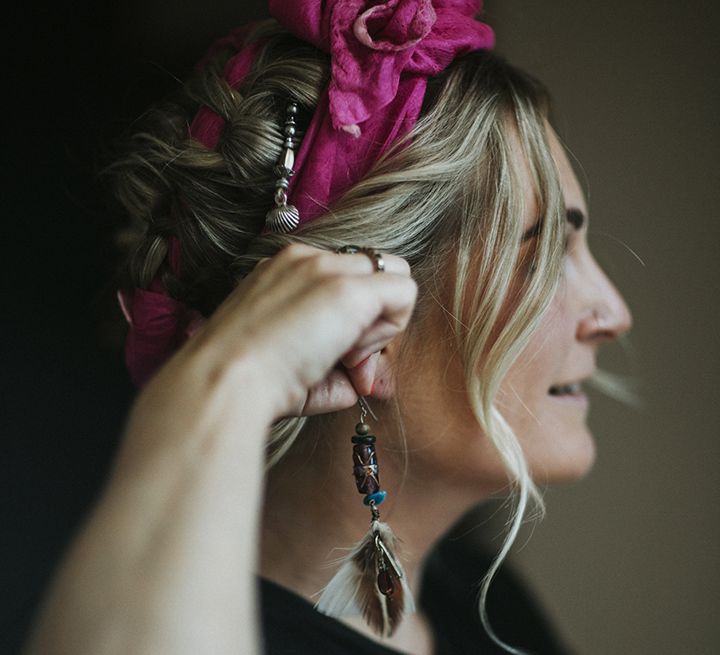 Bridesmaid with pink flower crown and feather bridesmaid earrings