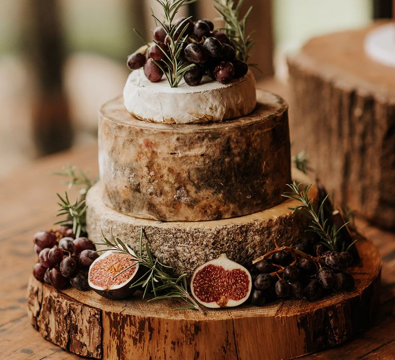 Cheese tower decorated with figs and other fruit for wedding 