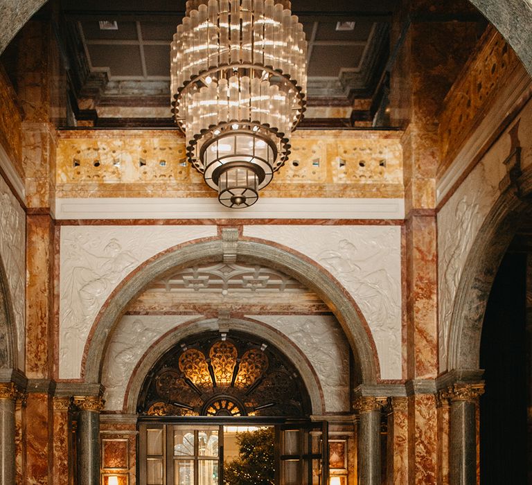 Bride and groom walking in the Kimpton Fitzroy London wedding hotel 