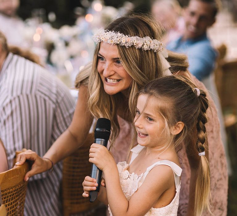 Bridesmaid and flower girl perform wedding speech together at the wedding breakfast 