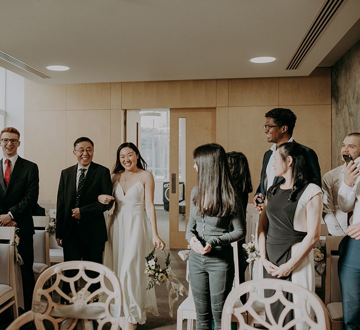 Wedding ceremony bridal entrance in sating wedding dress