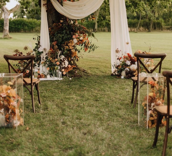 Natural, rustic outdoor ceremony at Reymerston Hall