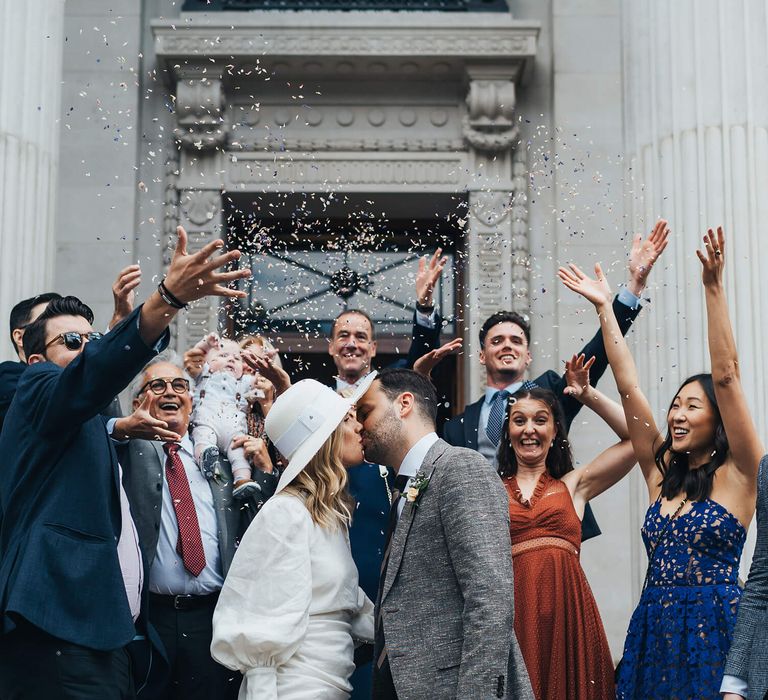 Marylebone wedding celebration confetti moment with short net a porter wedding dress 