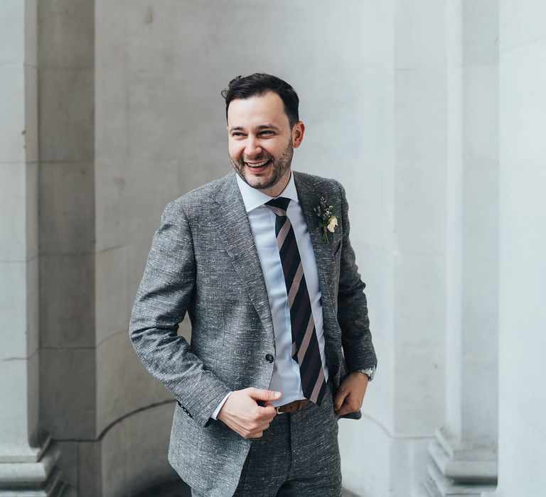 Groom wedding day photography with striped tie