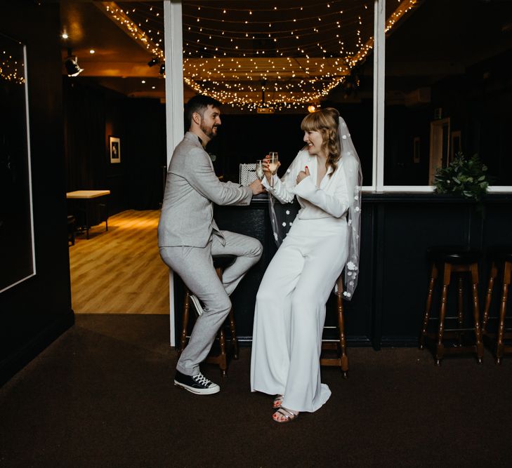 Bride and groom enjoying a drink together before the wedding ceremony to calm their nerves 