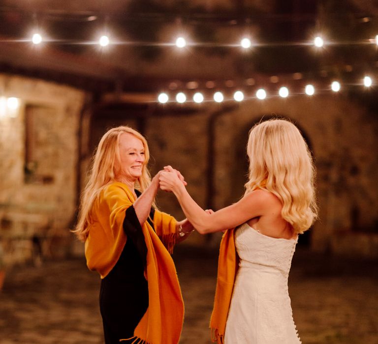 The bride dancing with her mother