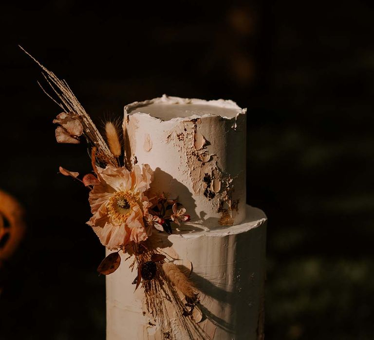 Buttercream wedding cake with dried and fresh floral arrangement 