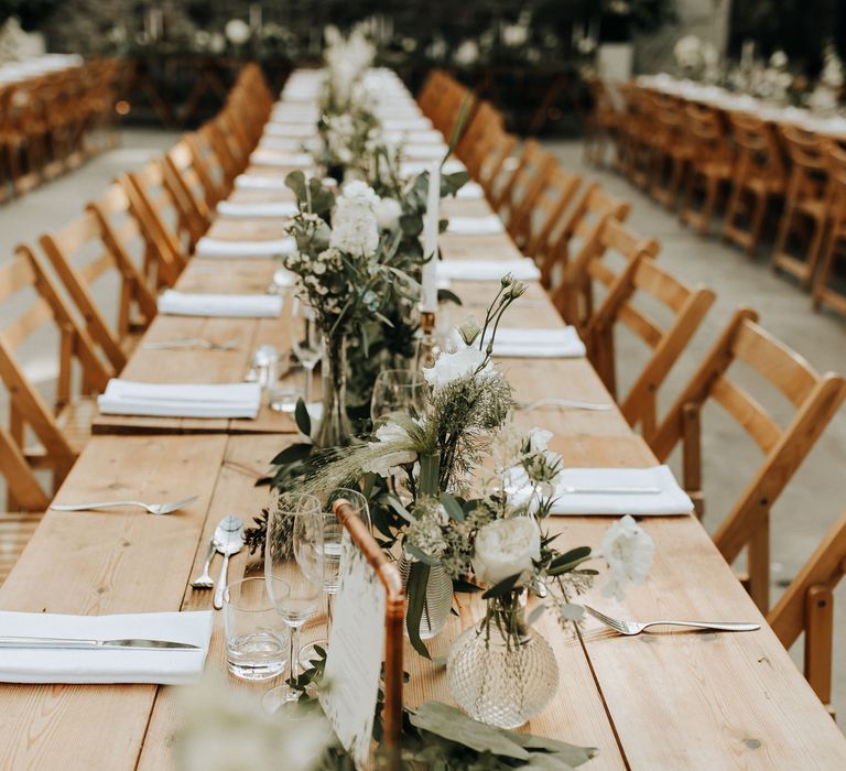 Rustic wedding table with foliage table runner