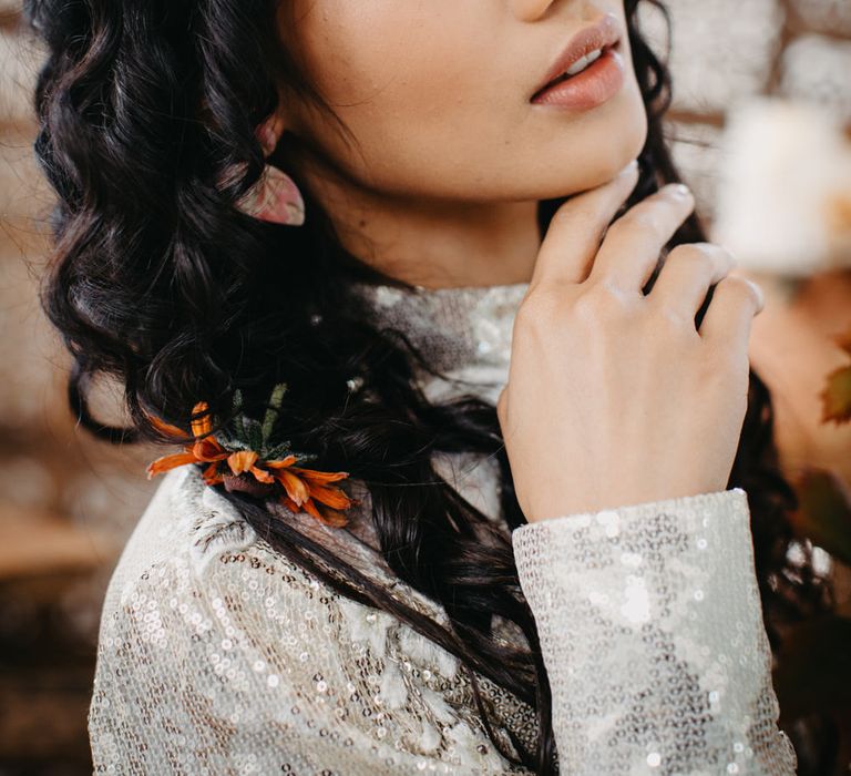 South Asian bridal makeup with light brown eyeshadow and gold flecks, and light brown matt lipstick 